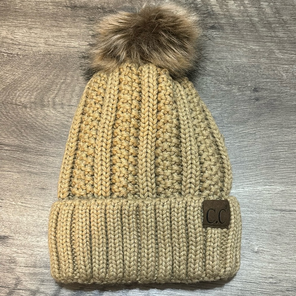 C.C tan gold beanie with puff ball
